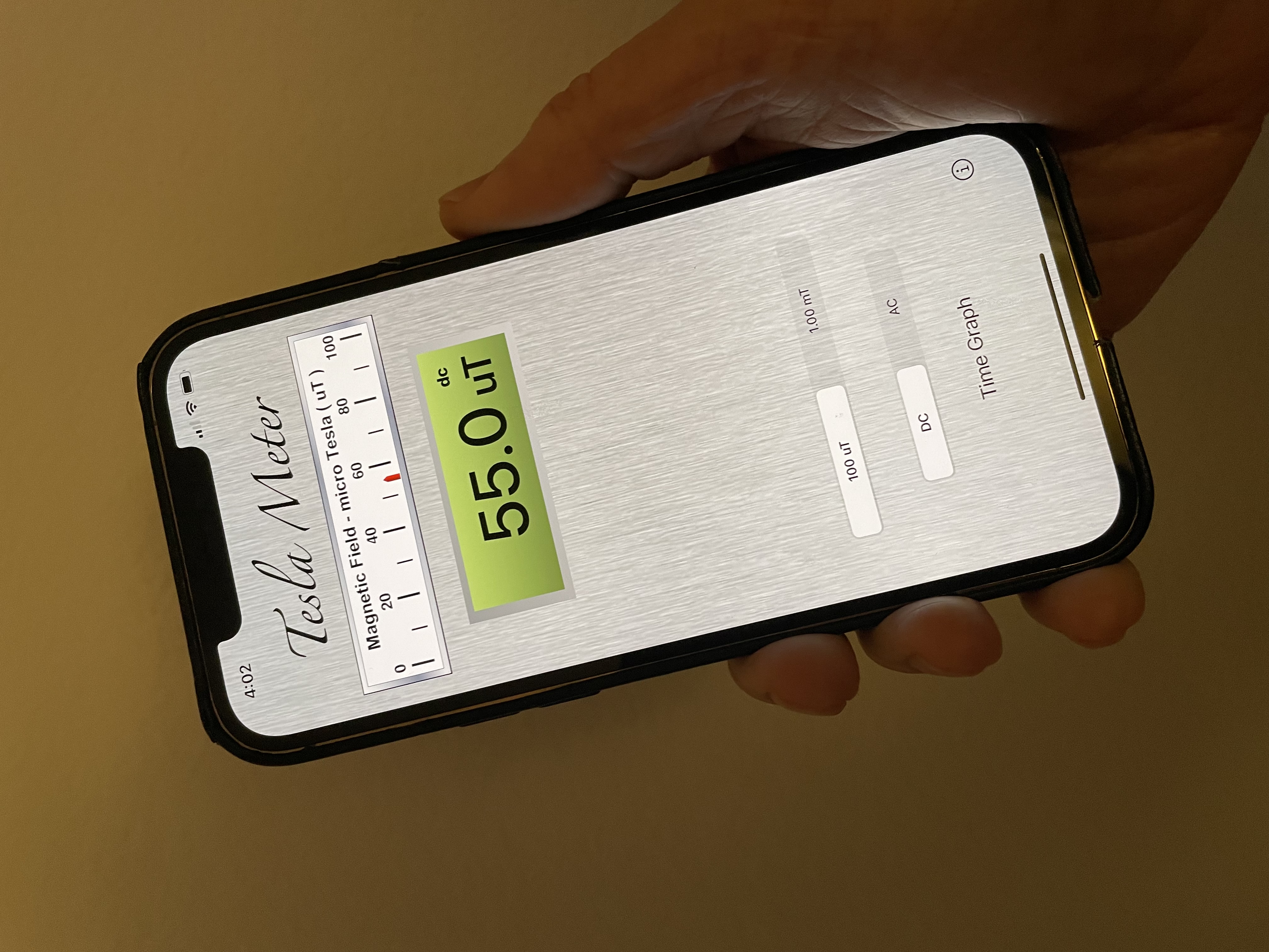 Tesla Field Meter showing 55.0 microtesla
